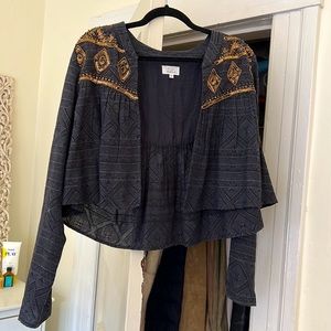 Cropped blue jacket with sequins. Size medium. Never worn.